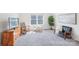 Bright living room with large window, entertainment center, and cozy seating area, perfect for relaxation and Gathering time at 8715 Gladden Hill Ln, Fort Mill, SC 29715