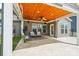 Inviting covered patio with ceiling fan, outdoor seating, and tiled flooring at 8715 Gladden Hill Ln, Fort Mill, SC 29715