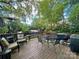 Spacious wooden back deck with outdoor seating, a grill, and string lights, perfect for entertaining at 1000 Margaret Brown St, Charlotte, NC 28202