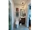 Cozy bathroom featuring modern fixtures, unique lighting, and neutral color palette at 1000 Margaret Brown St, Charlotte, NC 28202