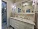 Bathroom vanity featuring double sinks, marble countertops, and elegant fixtures at 1000 Margaret Brown St, Charlotte, NC 28202