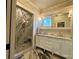 Updated bathroom with a marble walk-in shower and double sink vanity at 1000 Margaret Brown St, Charlotte, NC 28202