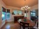 Charming dining room with hardwood floors, a decorative chandelier, and ample natural light at 1000 Margaret Brown St, Charlotte, NC 28202