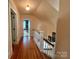Upstairs hallway with hardwood floors leading to various rooms in the home at 1000 Margaret Brown St, Charlotte, NC 28202