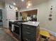 Modern kitchen island featuring marble countertops, stainless steel appliances, and stylish pendant lighting at 1000 Margaret Brown St, Charlotte, NC 28202