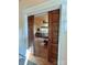 Stylish living room entrance with wood pocket doors, showcasing hardwood flooring and bright interior at 1000 Margaret Brown St, Charlotte, NC 28202