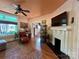 Cozy living room featuring hardwood floors, a fireplace, and large windows with lots of natural light at 1000 Margaret Brown St, Charlotte, NC 28202
