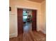 Elegant living room entrance with wood pocket doors, showcasing the interior and hardwood flooring at 1000 Margaret Brown St, Charlotte, NC 28202