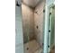 Stylish glass enclosed shower featuring modern fixtures, light tile, and elegant design at 1000 Margaret Brown St, Charlotte, NC 28202