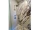 Close-up of a marble tiled shower with dual shower heads and mosaic tile floor at 1000 Margaret Brown St, Charlotte, NC 28202