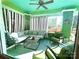Bright sunroom featuring comfortable seating, striped curtains, and ample natural light at 1000 Margaret Brown St, Charlotte, NC 28202