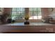 Bright window nook featuring a sill display with a statue and decorative arrangement, and view of lush greenery at 1000 Margaret Brown St, Charlotte, NC 28202