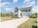 Charming two-story home featuring a long driveway, attached garage, and manicured front lawn at 101 Glencroft Dr, Wingate, NC 28174