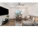 Cozy living room featuring a comfortable gray couch and chair, with natural light at 101 Glencroft Dr, Wingate, NC 28174