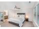 Comfortable main bedroom with a ceiling fan, a view to an attached bathroom and a side window at 101 Glencroft Dr, Wingate, NC 28174