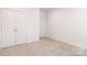 Bedroom with neutral carpet and double door closet at 1032 Dooley Dr, Charlotte, NC 28227