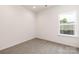 Cozy, carpeted bedroom featuring a bright window at 1032 Dooley Dr, Charlotte, NC 28227