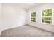 Bright bedroom with natural light and view of trees through the windows at 1032 Dooley Dr, Charlotte, NC 28227
