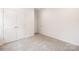 Cozy bedroom features neutral carpet, white trim, and closet storage at 1032 Dooley Dr, Charlotte, NC 28227