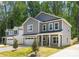 Attractive two-story home with gray siding, a two-car garage, and a well-maintained front lawn at 1032 Dooley Dr, Charlotte, NC 28227