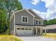 Beautiful two-story home boasts a two-car garage, inviting entrance, and lovely curb appeal at 1032 Dooley Dr, Charlotte, NC 28227