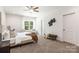 Spacious bedroom with ample natural light, carpet flooring and tasteful furnishings at 1032 Dooley Dr, Charlotte, NC 28227