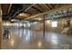 Unfinished basement with concrete flooring and exposed ceiling at 106 Zurich Ln, Statesville, NC 28625