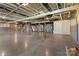 Unfinished basement with concrete floor, exposed ceiling, and structural supports at 106 Zurich Ln, Statesville, NC 28625