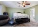 Comfortable bedroom with a ceiling fan, a large window, and neutral carpet at 106 Zurich Ln, Statesville, NC 28625