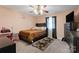 Cozy bedroom with a ceiling fan, large window and a rustic headboard at 106 Zurich Ln, Statesville, NC 28625
