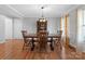 Inviting dining area featuring a rustic table, chandelier, and natural light at 106 Zurich Ln, Statesville, NC 28625