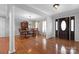 Elegant dining room boasts hardwood floors, stylish chandelier, and classic decor at 106 Zurich Ln, Statesville, NC 28625