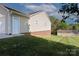 View of the house's siding and a shed in the backyard at 106 Zurich Ln, Statesville, NC 28625