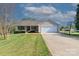 Charming single-story home featuring a well-manicured lawn, two-car garage, and a basketball hoop at 106 Zurich Ln, Statesville, NC 28625