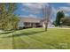 A well-maintained home with a neat front yard and porch, showcasing its curb appeal at 106 Zurich Ln, Statesville, NC 28625