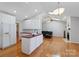 Open kitchen with an island flows into a living area, perfect for entertaining guests at 106 Zurich Ln, Statesville, NC 28625