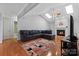 Comfortable living room with vaulted ceilings, fireplace, hardwood floors, and lots of light at 106 Zurich Ln, Statesville, NC 28625