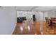 Open-concept living area with hardwood floors, fireplace, and a comfortable seating area at 106 Zurich Ln, Statesville, NC 28625