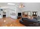 Open-concept living space boasting hardwood floors, a kitchen, and ample seating at 106 Zurich Ln, Statesville, NC 28625