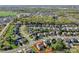 Aerial view of a home in a neighborhood with well-manicured lawns, mature trees, and a desirable location at 10643 Rippling Stream Nw Dr, Concord, NC 28027