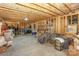 Unfinished basement with exposed framing, concrete floor, and ample storage space at 10643 Rippling Stream Nw Dr, Concord, NC 28027