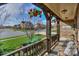 Cozy front porch with hanging flower baskets, seating, and a welcoming atmosphere in a neighborhood at 10643 Rippling Stream Nw Dr, Concord, NC 28027