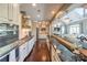 Spacious gourmet kitchen with stainless steel appliances, granite countertops, and breakfast bar at 10643 Rippling Stream Nw Dr, Concord, NC 28027