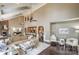 Spacious living room with wood floors, multiple sitting areas, and high ceilings with fans at 10643 Rippling Stream Nw Dr, Concord, NC 28027