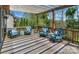 Inviting patio features a pergola, stylish seating, and a striped outdoor rug perfect for relaxation and entertaining at 10643 Rippling Stream Nw Dr, Concord, NC 28027