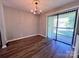 Bright dining area with wood floors, a chandelier, and sliding door access to the outside at 11015 Harrowfield Rd, Charlotte, NC 28226