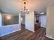 Cozy dining area with a chandelier, access to the kitchen and nearby living area at 11015 Harrowfield Rd, Charlotte, NC 28226