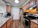 Well-equipped kitchen with granite countertops, stainless steel appliances, and wood floors at 11015 Harrowfield Rd, Charlotte, NC 28226