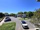 Spacious parking lot with lush green spaces and well-maintained buildings, offering convenience and an appealing environment at 11015 Harrowfield Rd, Charlotte, NC 28226