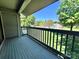 A private back patio offers a tranquil retreat for outdoor relaxation and entertaining with views of greenery at 11015 Harrowfield Rd, Charlotte, NC 28226